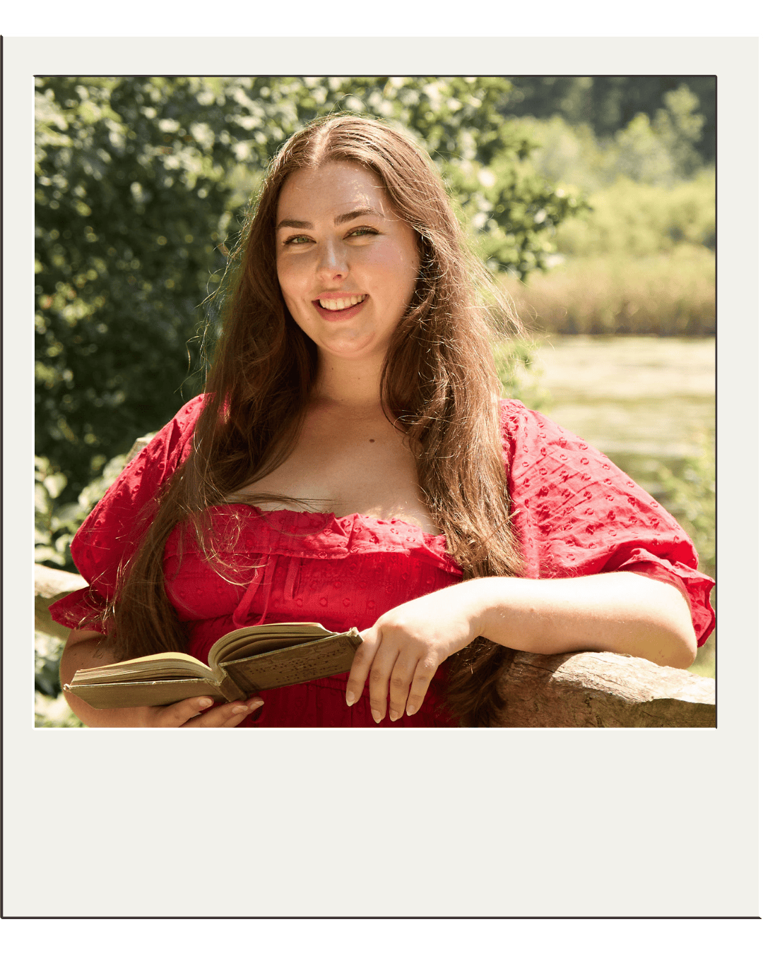 Elser smiling with a book