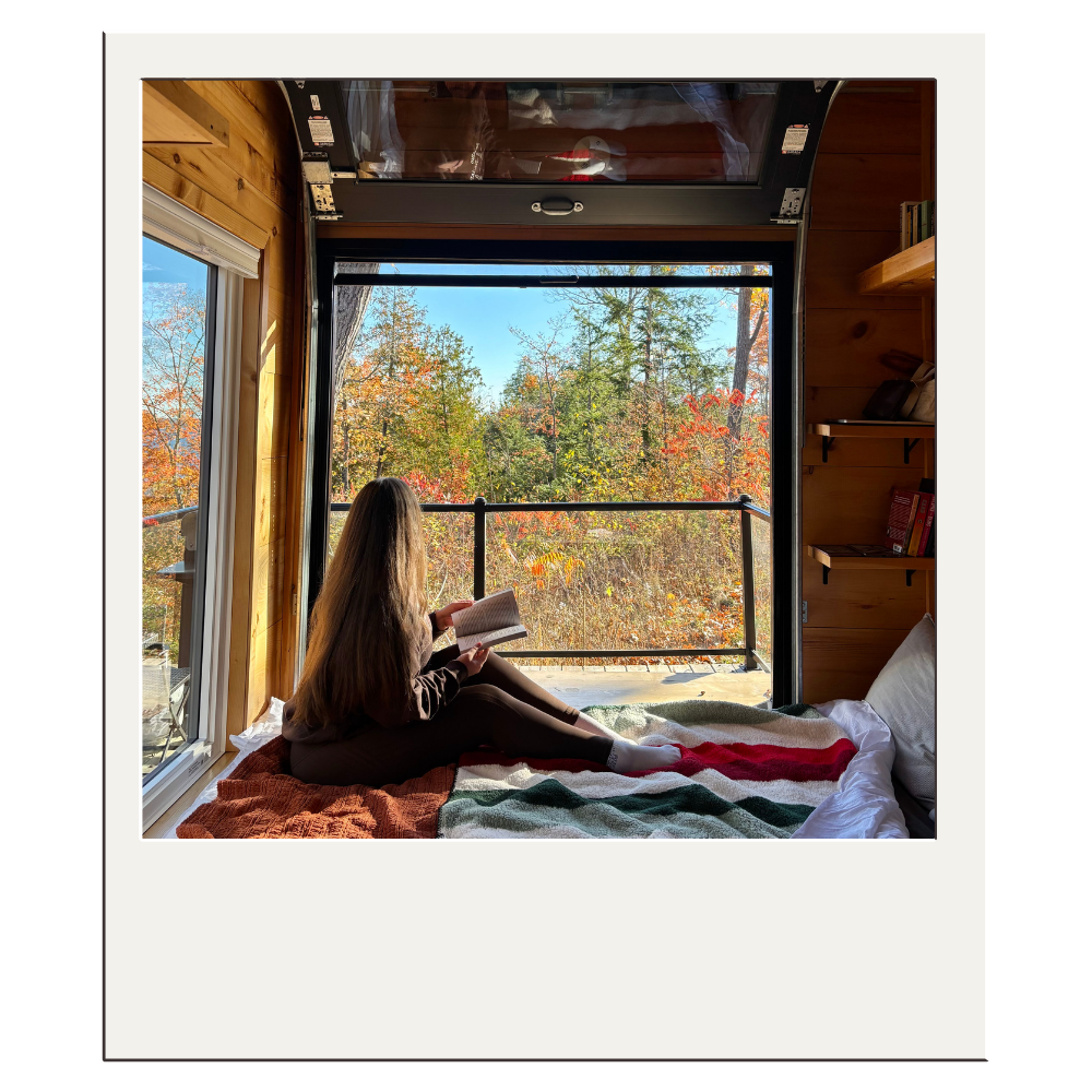 Elser reading in bed
