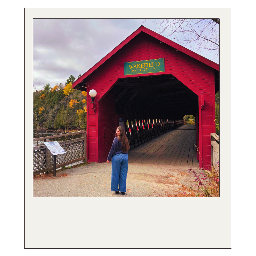 Elser in front of a covered bridge